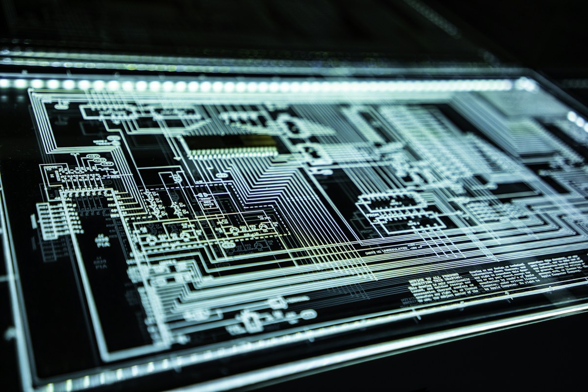 A digital visualization of an integrated circuit and its electronic pathways.